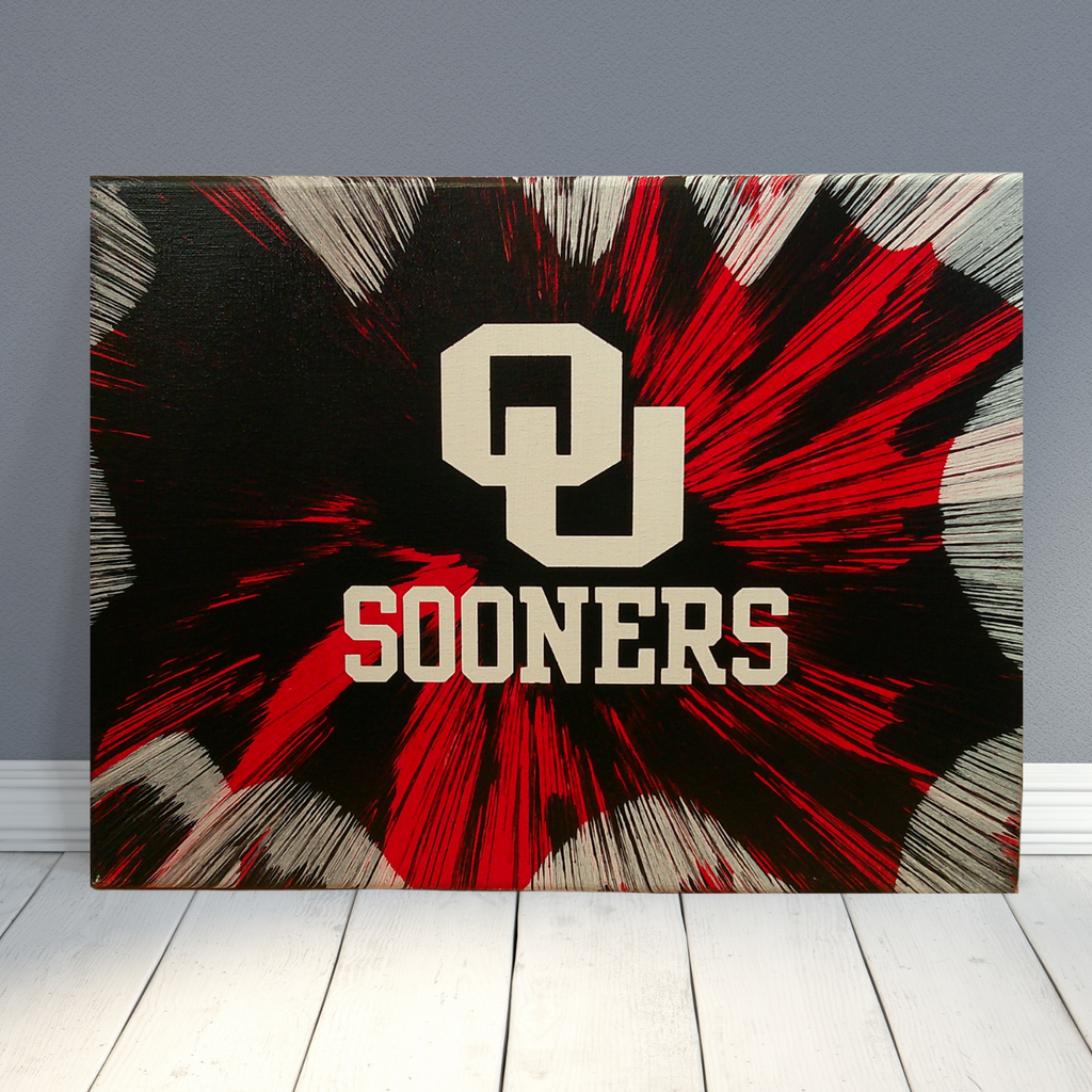 Spin Art canvas with 'OU Sooners' logo on a gray wall background