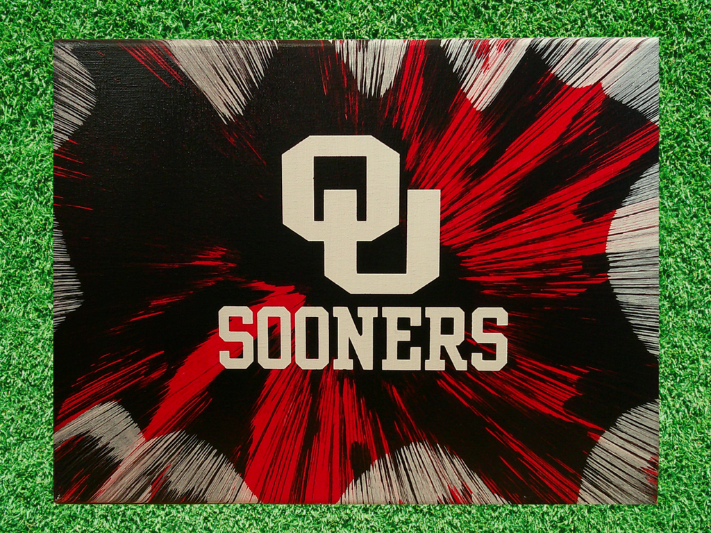 OU Sooners logo on a black and red abstract background