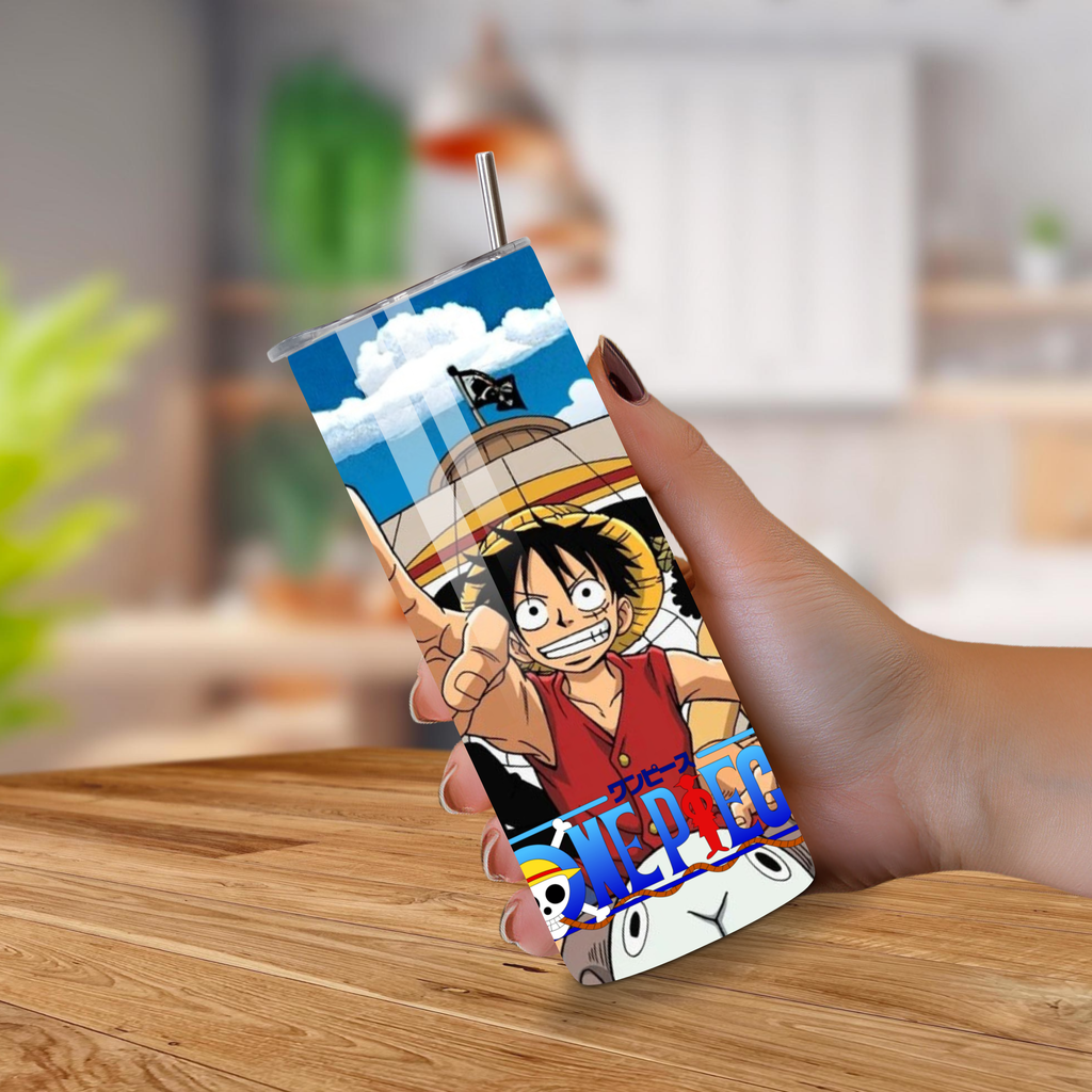 Tumbler with anime characters One Piece design held by a hand on a wooden surface