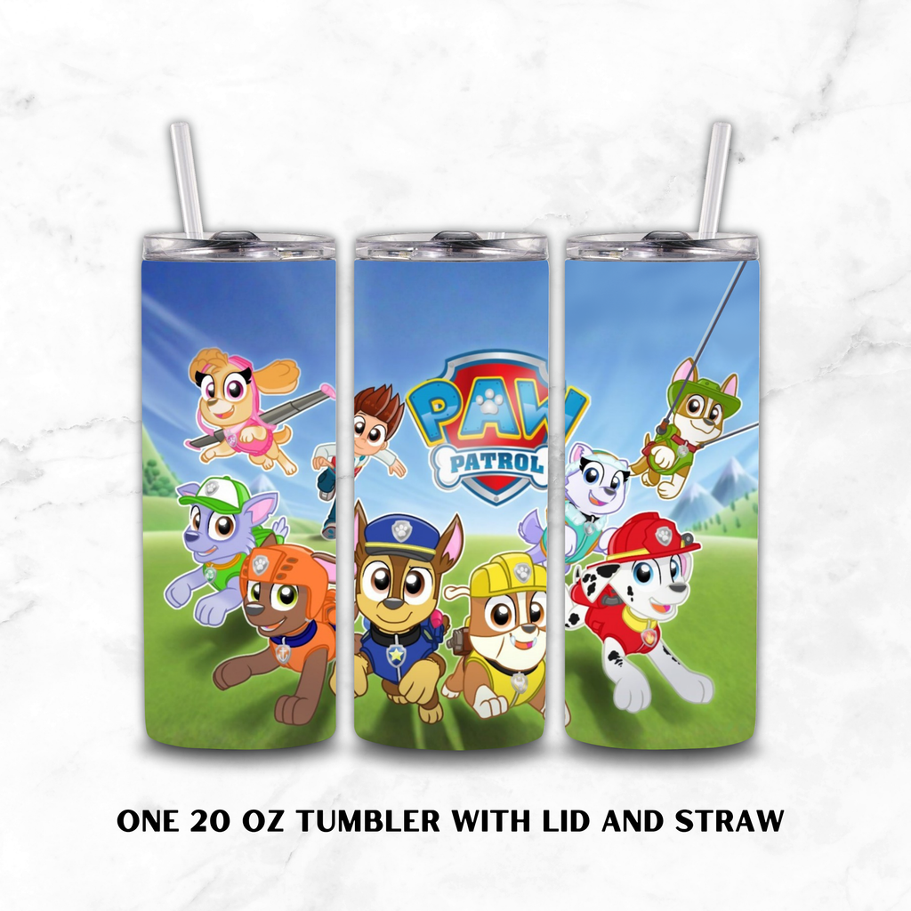 Three 20 oz tumblers with lids and straws shown side by side, featuring a colorful Paw Patrol cartoon print on a light marble background. Text below reads 'ONE 20 OZ TUMBLER WITH LID AND STRAW'.