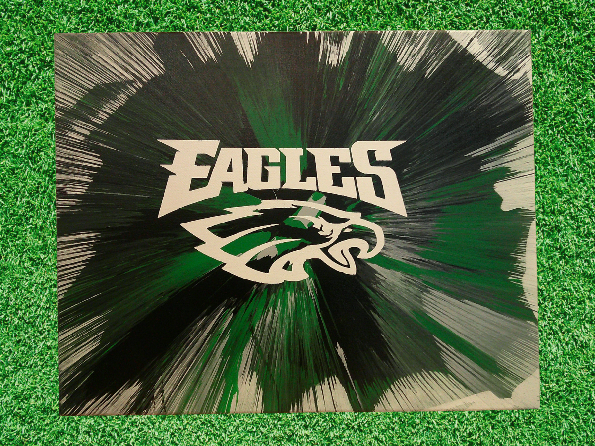 Custom Spin Art Eagles logo with dynamic team colors background on green grass