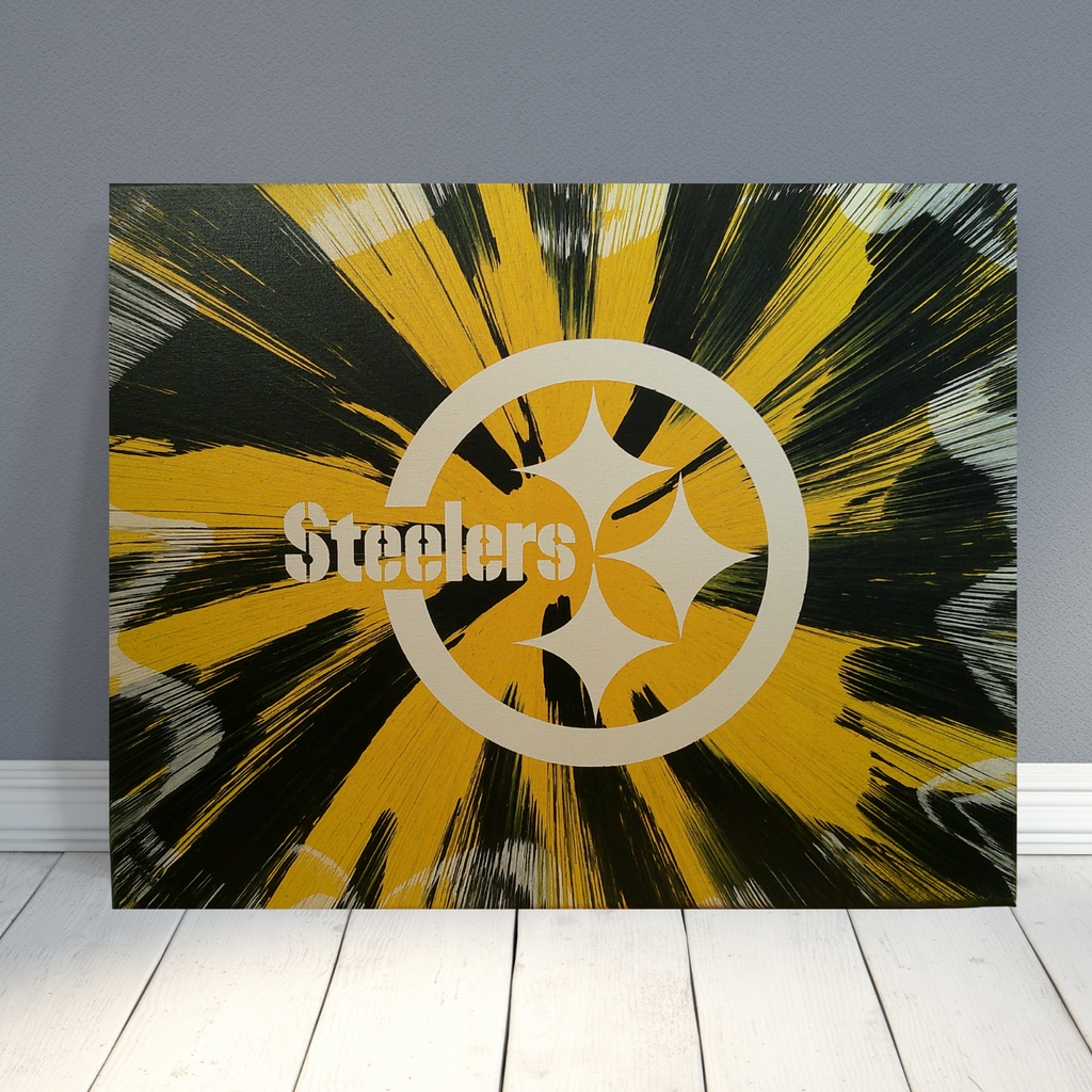 Pittsburgh Steelers logo with abstract yellow and black design on a gray wall.