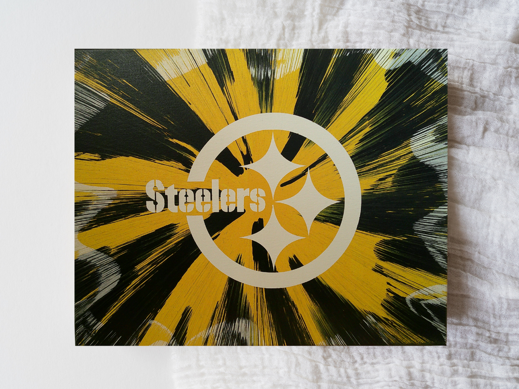Pittsburgh Steelers logo with yellow and black abstract design on a textured surface