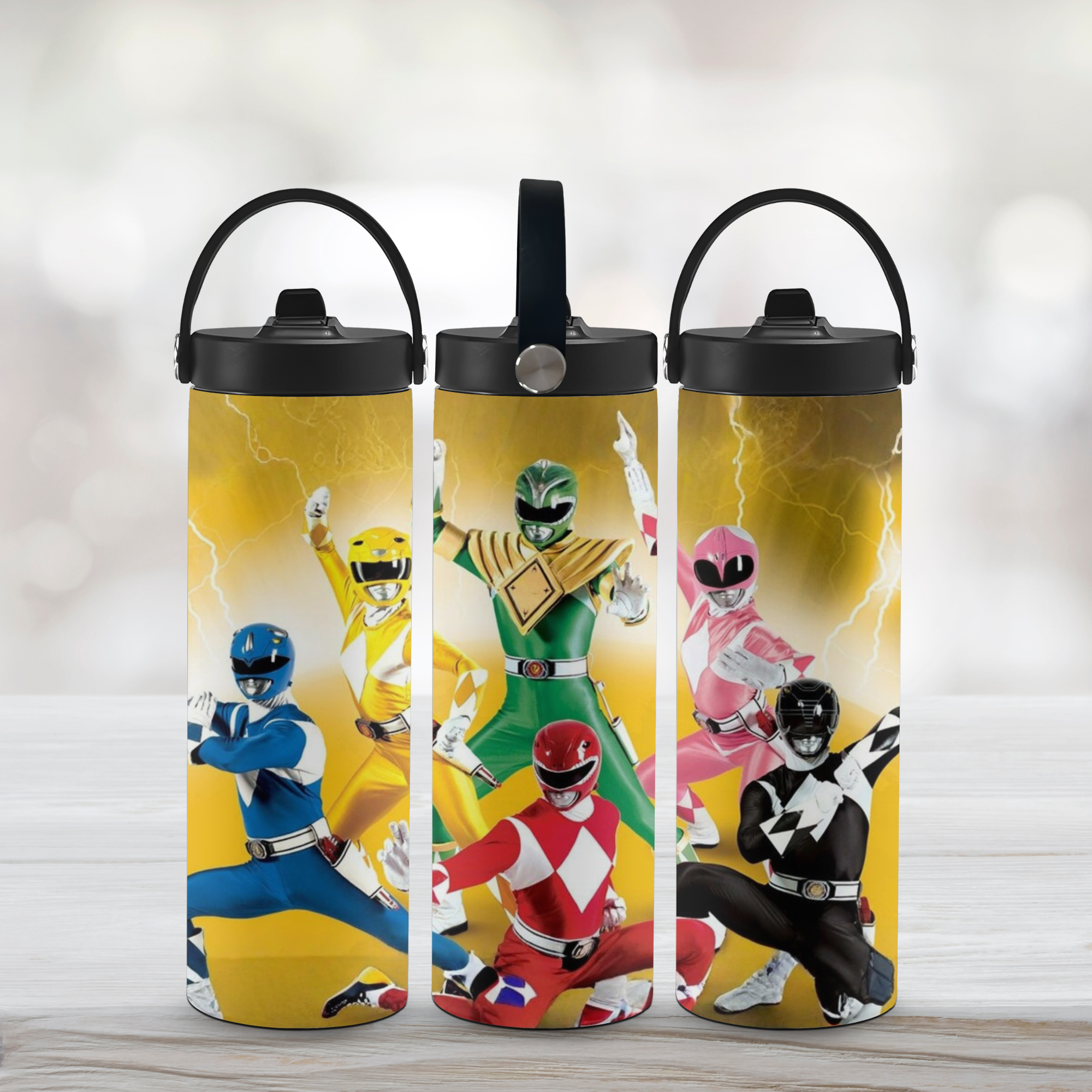 Three water bottles with Power Ranger designs on a light background