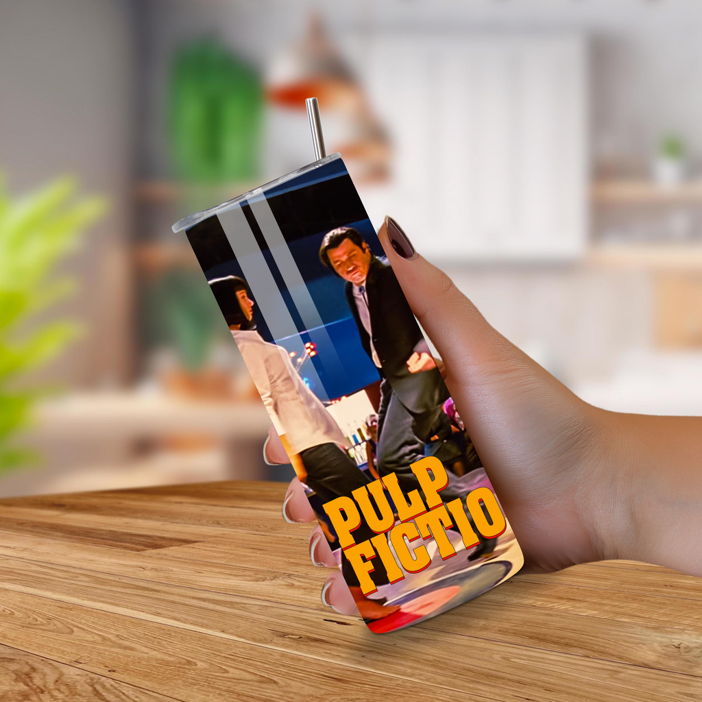 Tumbler with 'Pulp Fiction' design held by a hand on a wooden surface