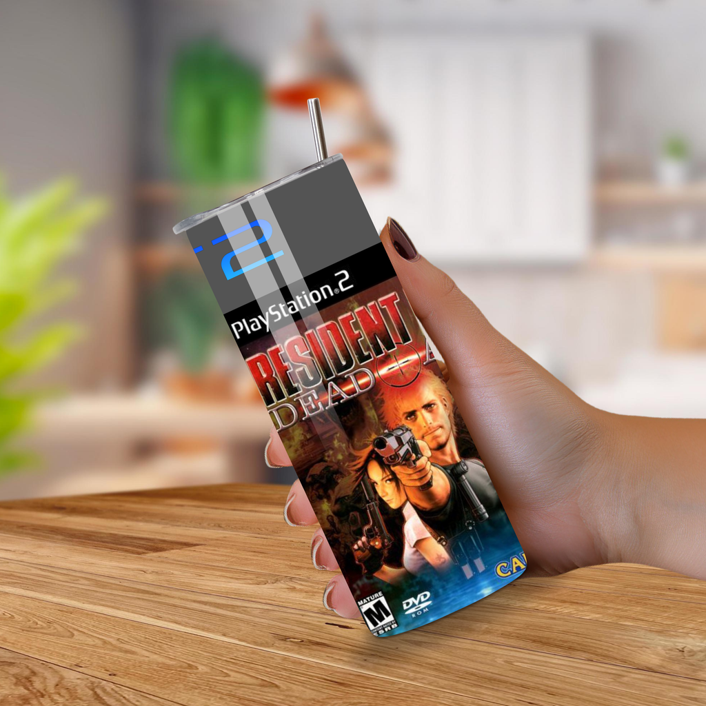 Hand holding a PlayStation 2 game 20oz Tumbler for 'Resident Evil: Dead Aim' on a wooden surface