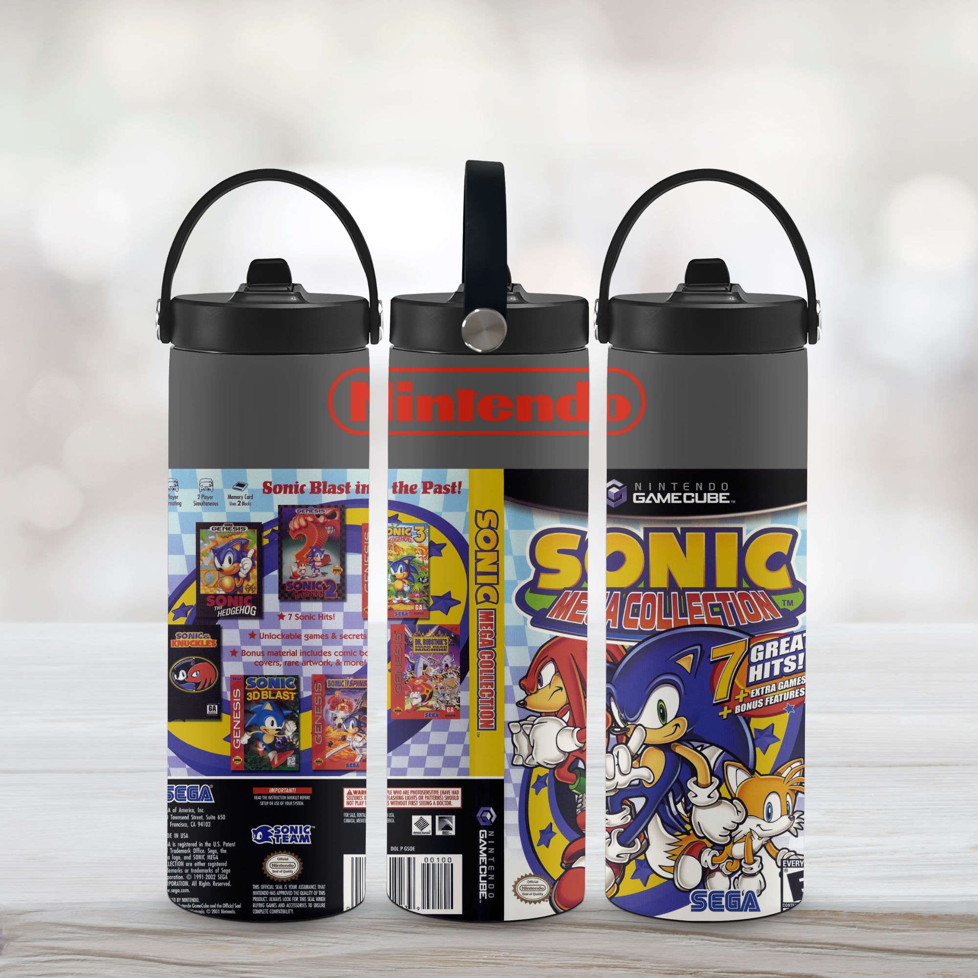 Three 20oz tumblers with Sonic the Hedgehog design on a wooden surface.