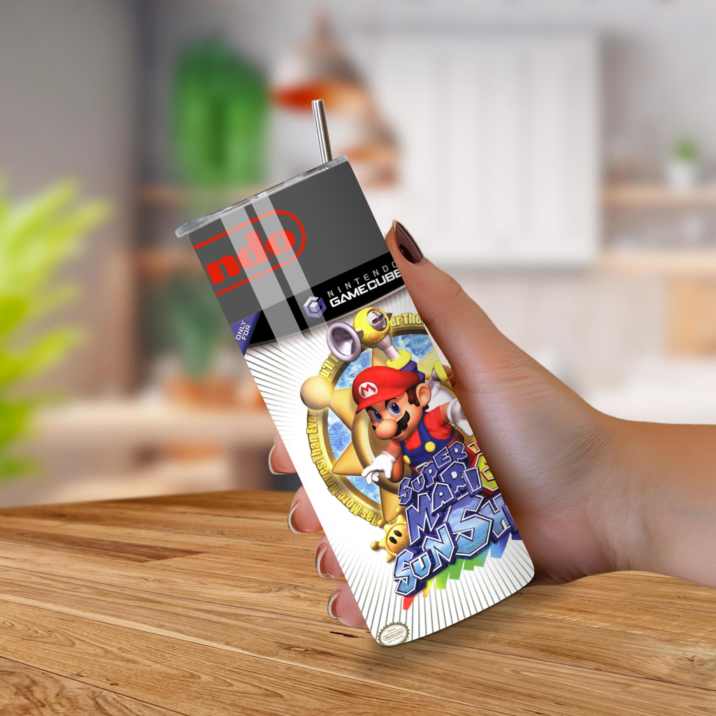 Hand holding a 20oz Tumbler with Mario design on a wooden surface