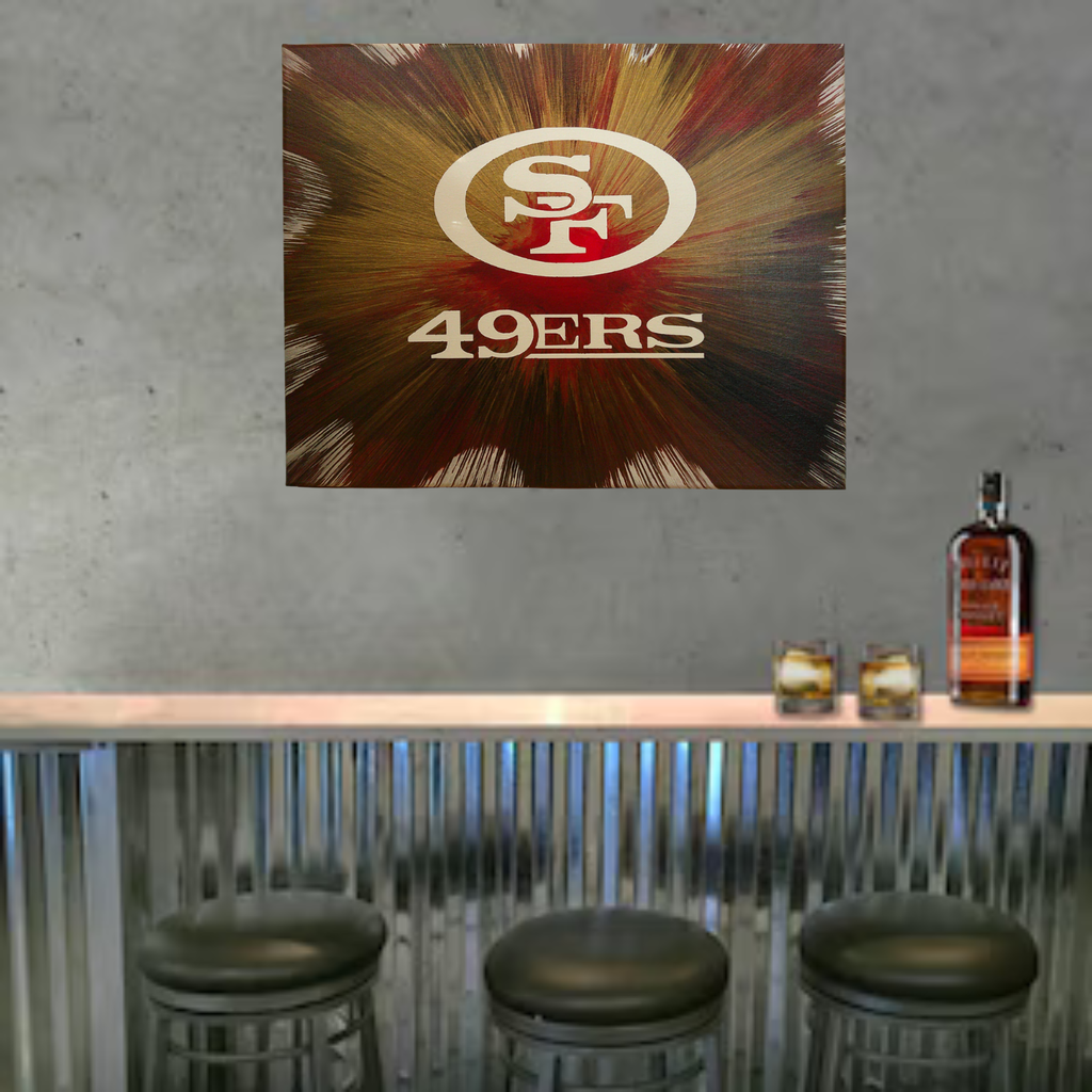 San Francisco 49ers Spin Art on a wall above a bar with stools and a bottle of liquor.