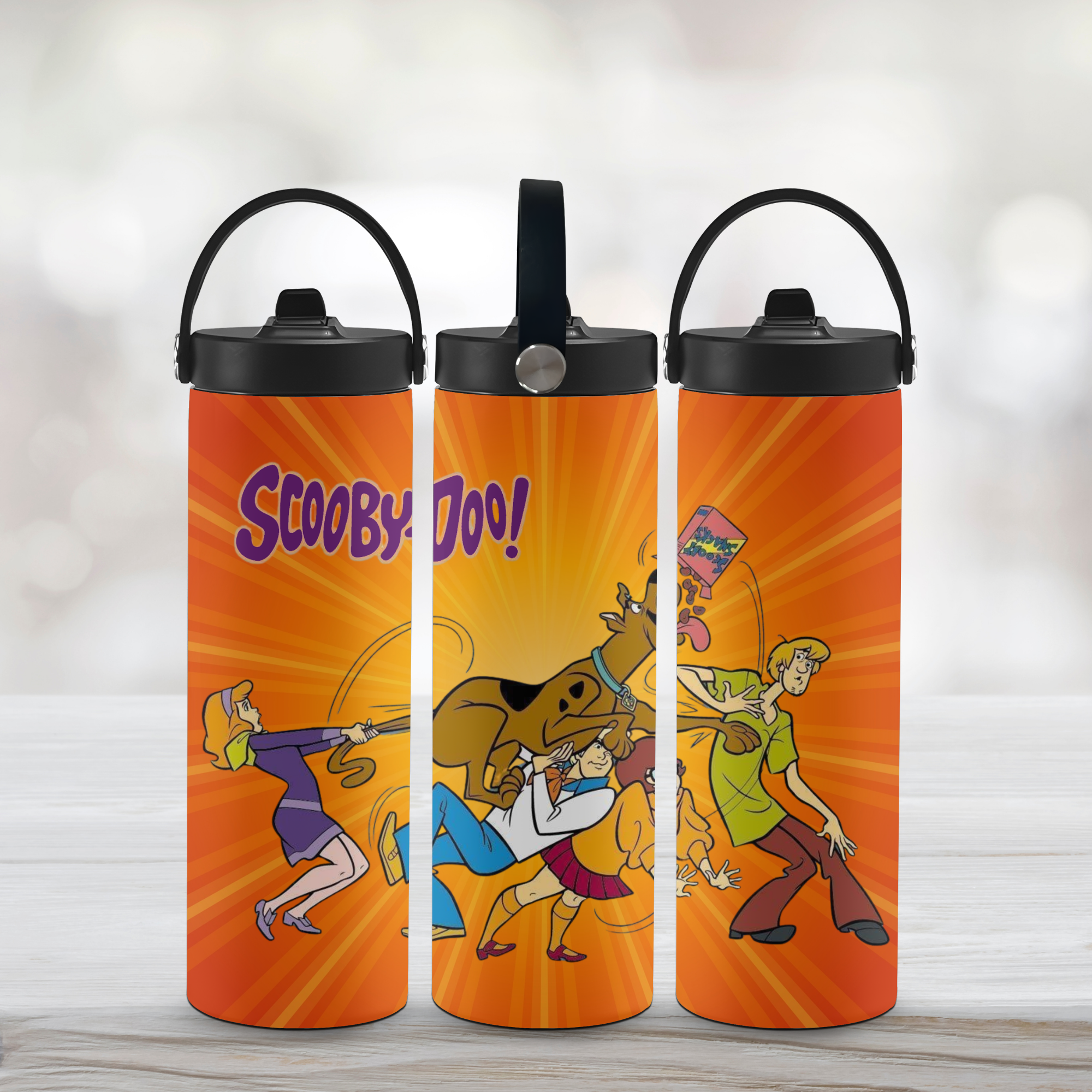 Three orange Sports water bottles with cartoon characters and 'Scooby-Doo!' text on a light background