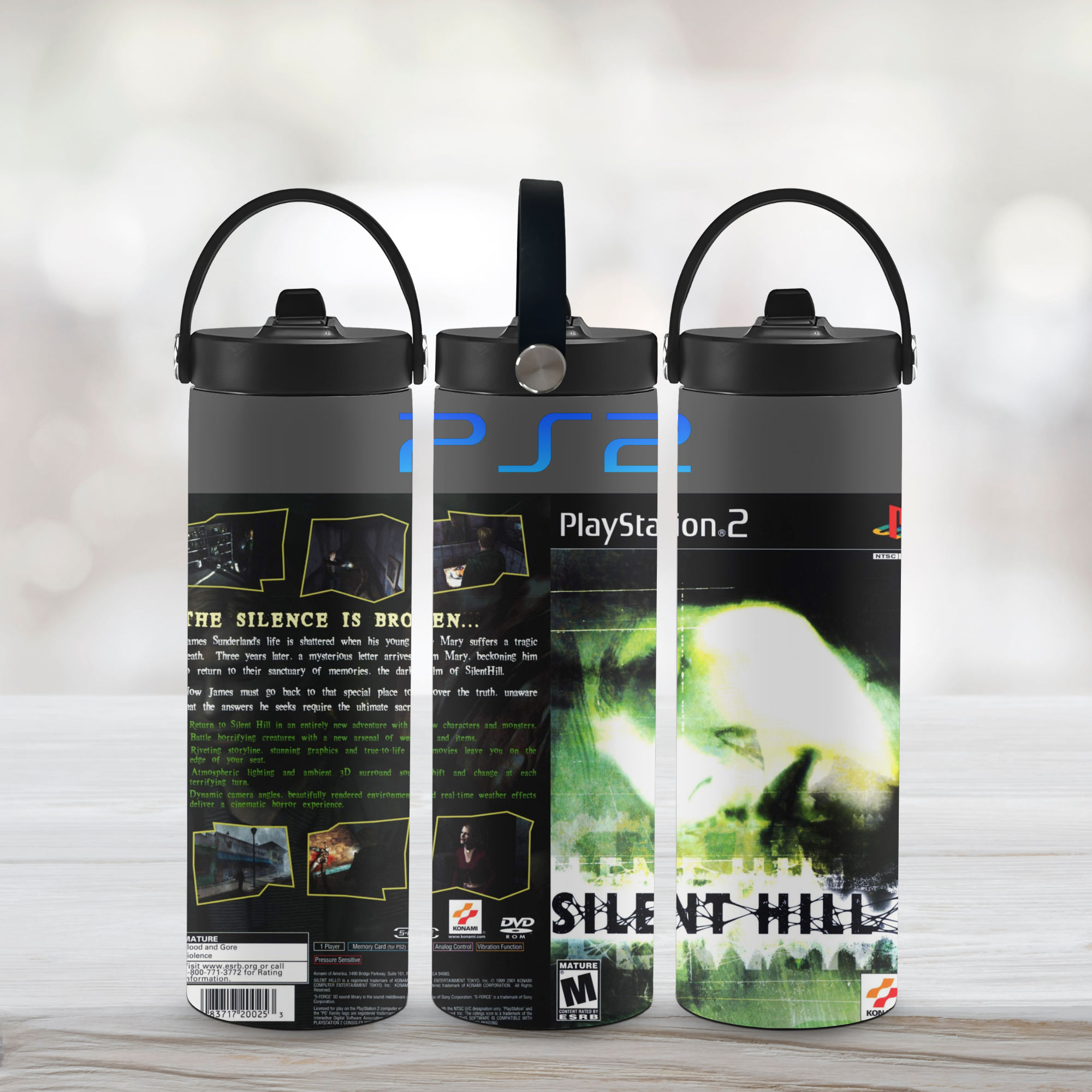 Three 'Silent Hill 2' themed water bottles with PlayStation 2 branding on a light wooden surface.