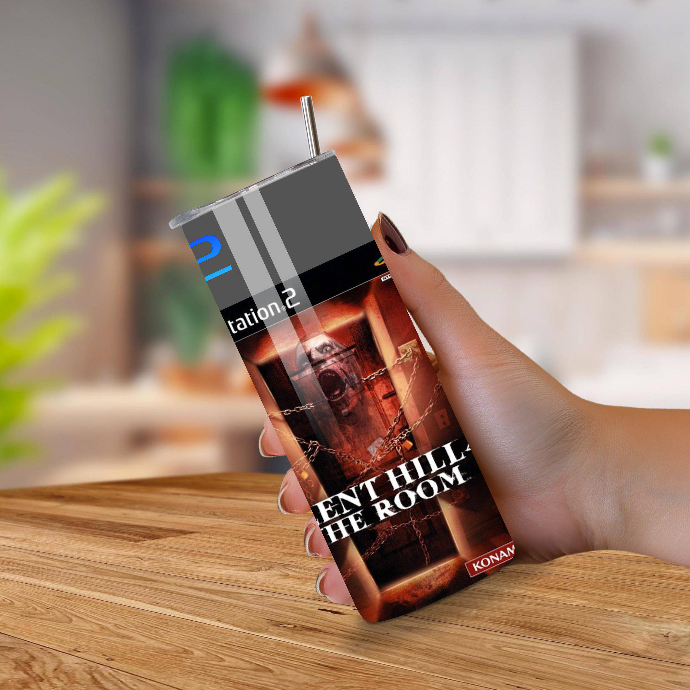 Hand holding a 20oz tumbler of 'Silent Hill 4 The Room' with a blurred kitchen background