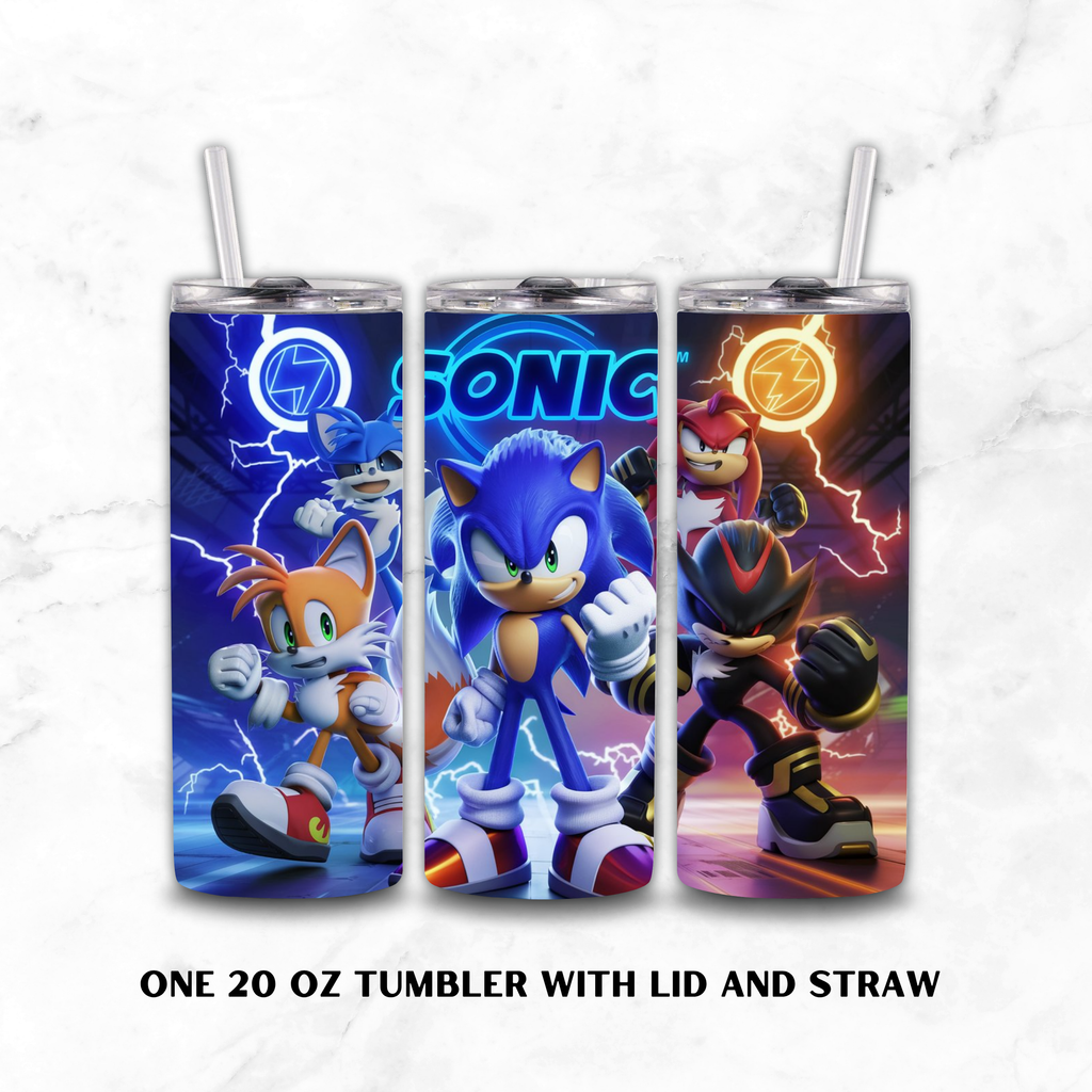 Three 20 oz tumblers with lids and clear straws, each printed with a different Sonic the Hedgehog character design: Tails, Sonic, and Knuckles. The tumblers are shown on a light marble background with the text 'ONE 20 OZ TUMBLER WITH LID AND STRAW' below.