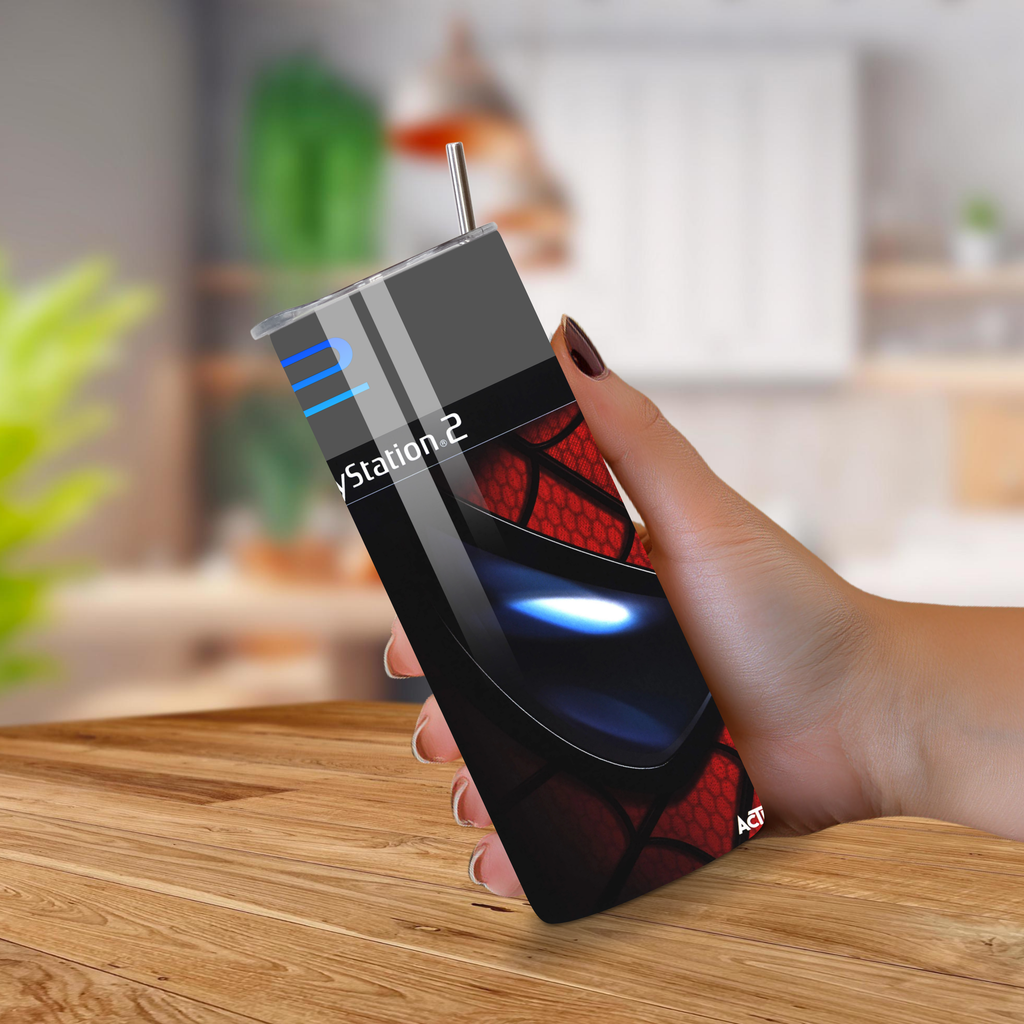 Hand holding a 20oz tumbler spider-man theme with a blurred indoor background