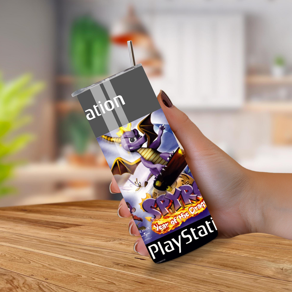 Person holding a 20oz tumbler with a 'Spyro' design on a wooden surface