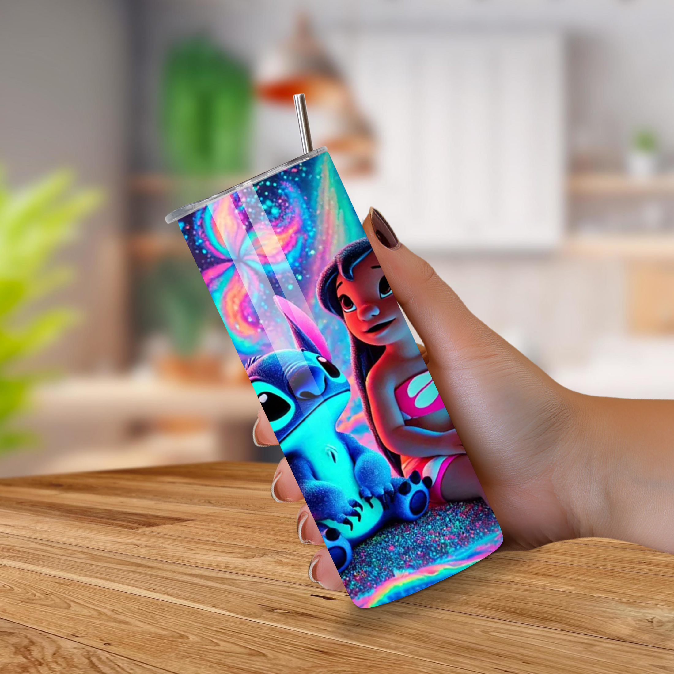 Colorful tumbler with Stitch cartoon characters held by a hand on a wooden surface.