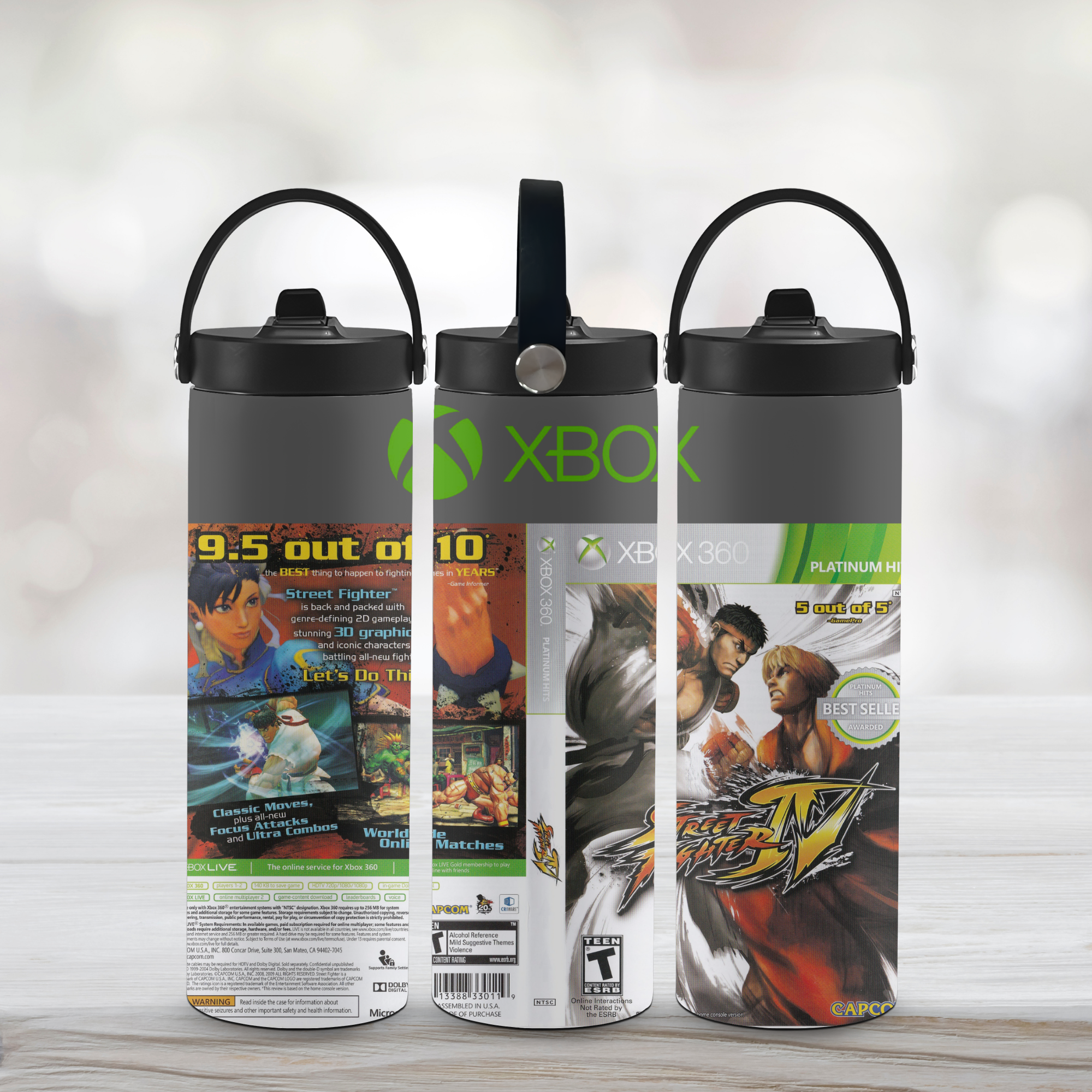 Three street fighter-branded water bottles with video game covers on a light wooden surface.