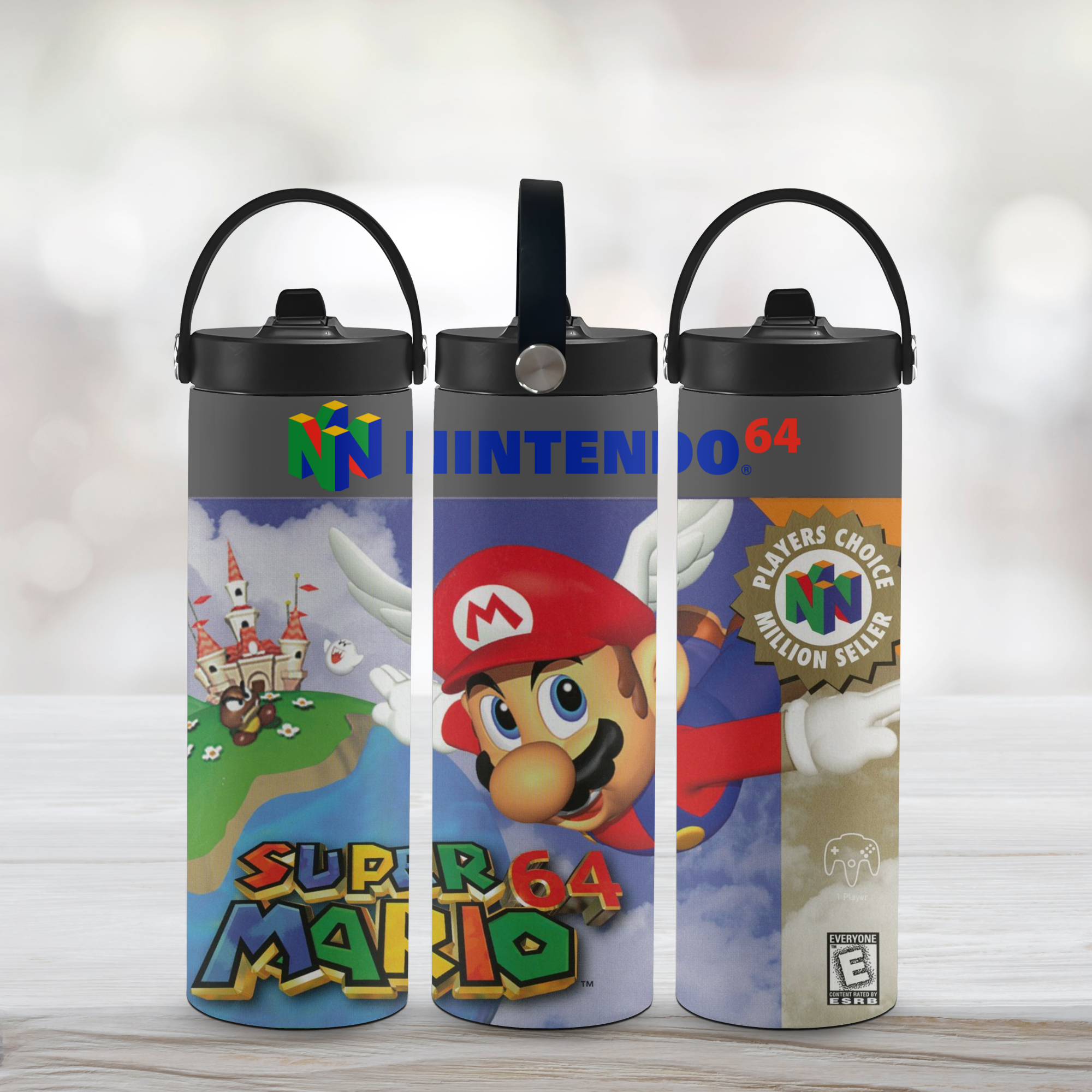Three sports water bottles with super mario 64-themed designs on a light background