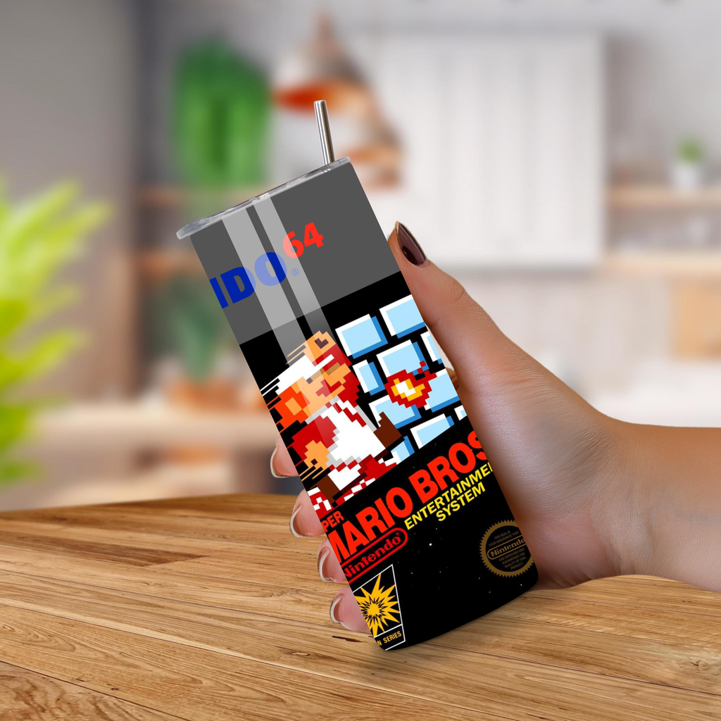 Hand holding a tumbler video game design Mario Bros on a wooden surface