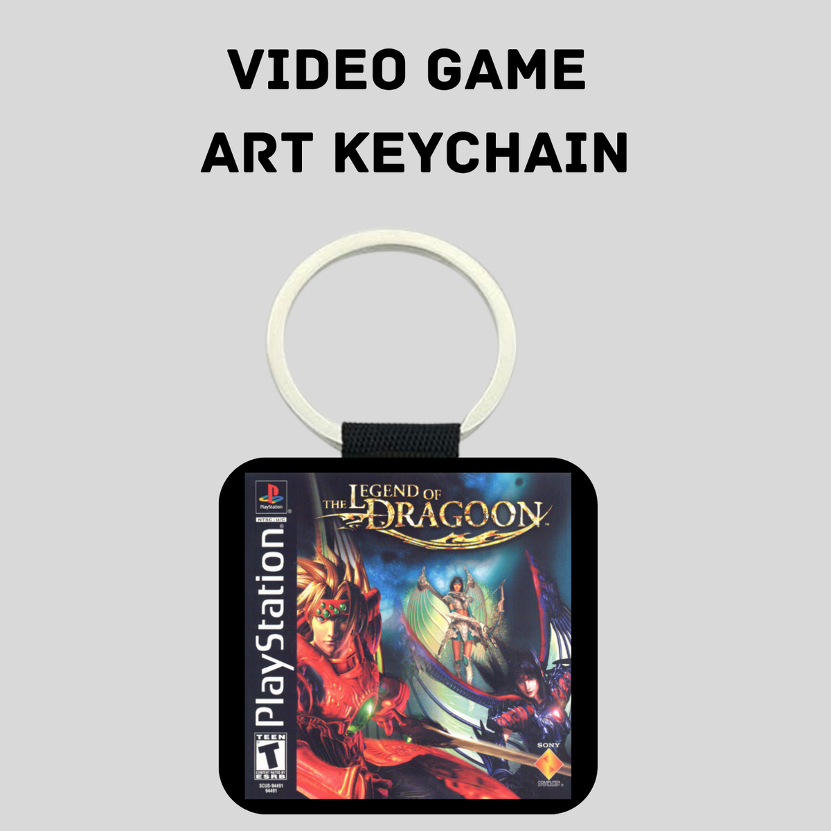 A PlayStation 1 themed keychain featuring artwork from the video game 'The Legend of Dragoon'. The keychain has a black body, a silver ring, and a black strap.
