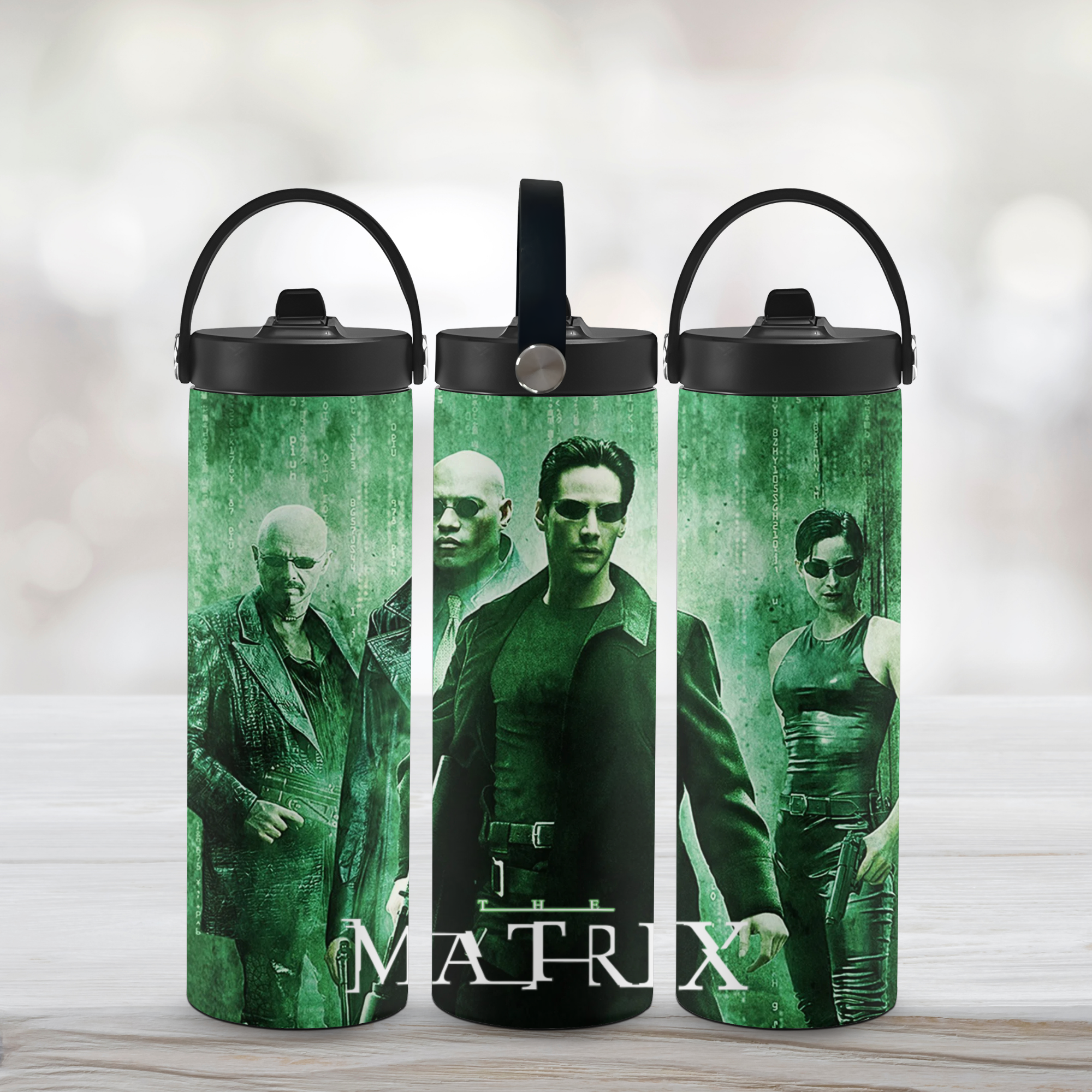 Three green tumblers with 'The Matrix' movie characters on a white background