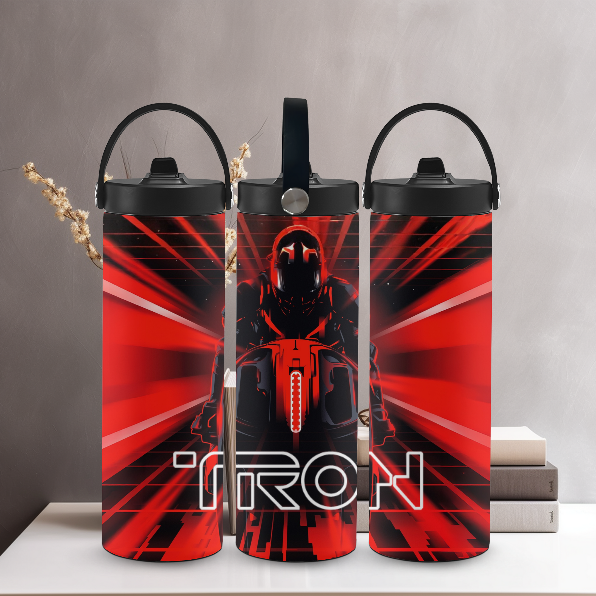 Three red and black 'TRON' themed water bottles on a gray background