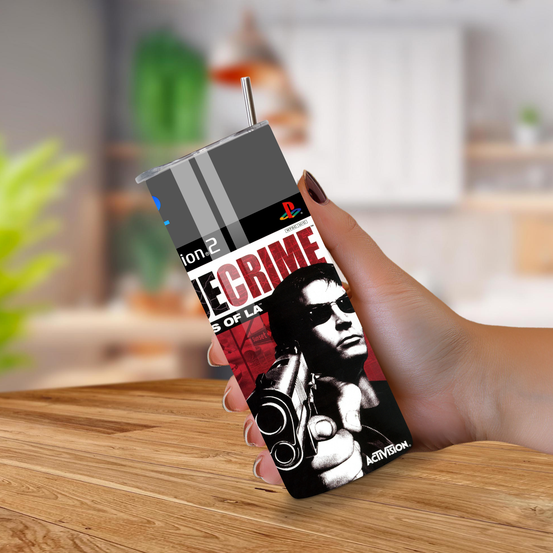 20oz Tumbler with a design True Crime Streets of La, placed on a wooden surface.