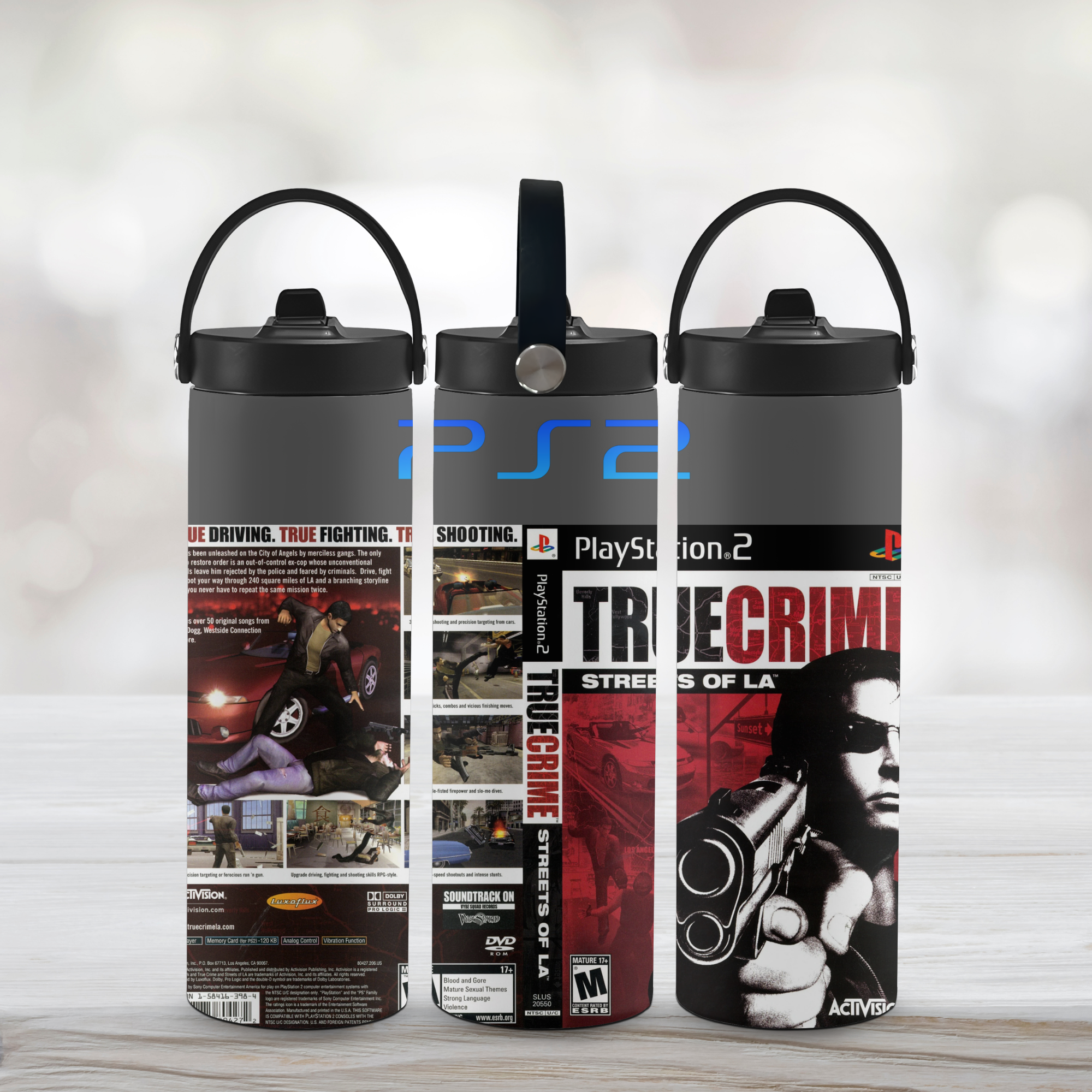 Three sports water bottles with True Crime Streets of La-themed designs on a light wooden surface.