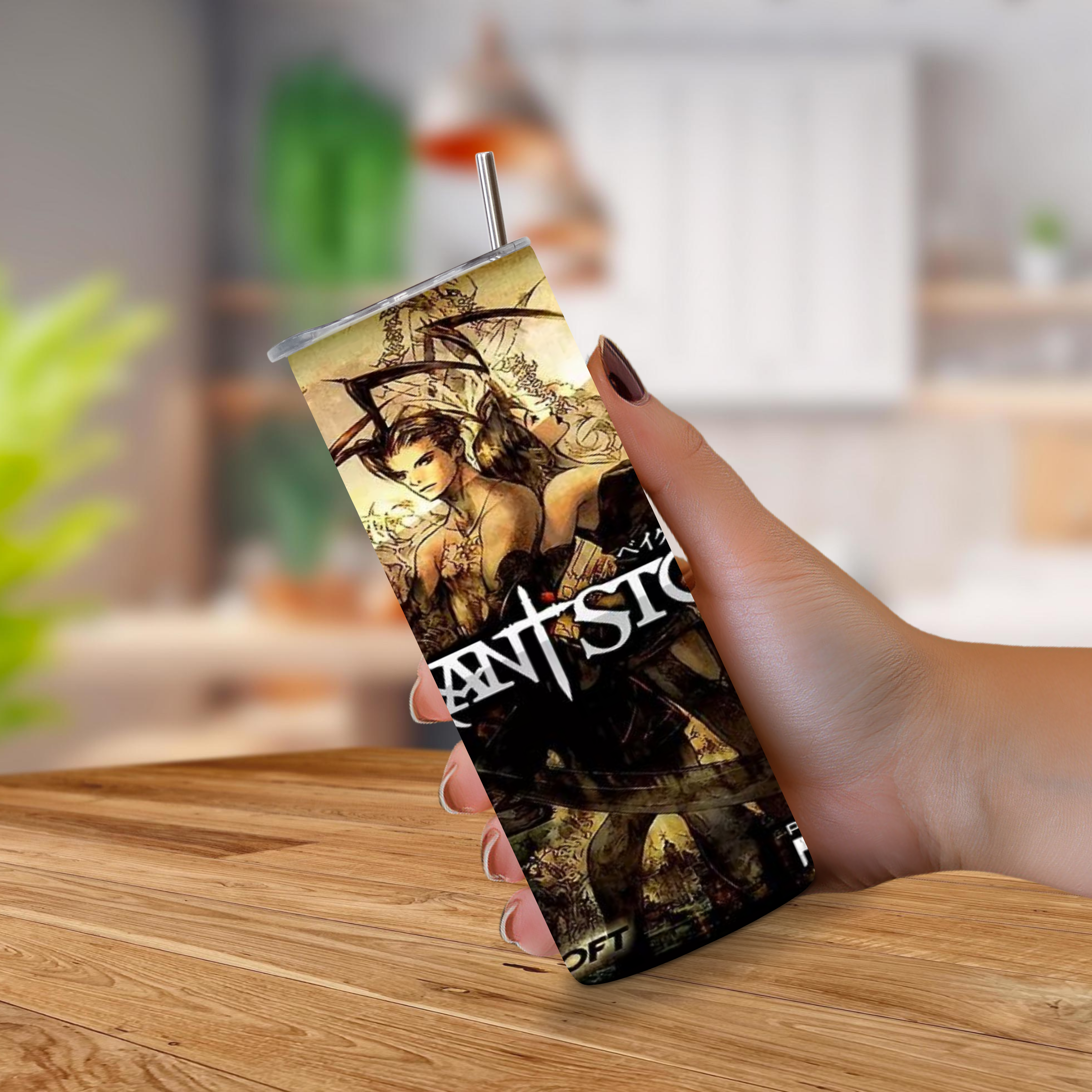 A hand holding a 20oz slim tumbler with a metal straw, featuring fantasy artwork and the text 'Vagrant Story' on a blurred indoor background.