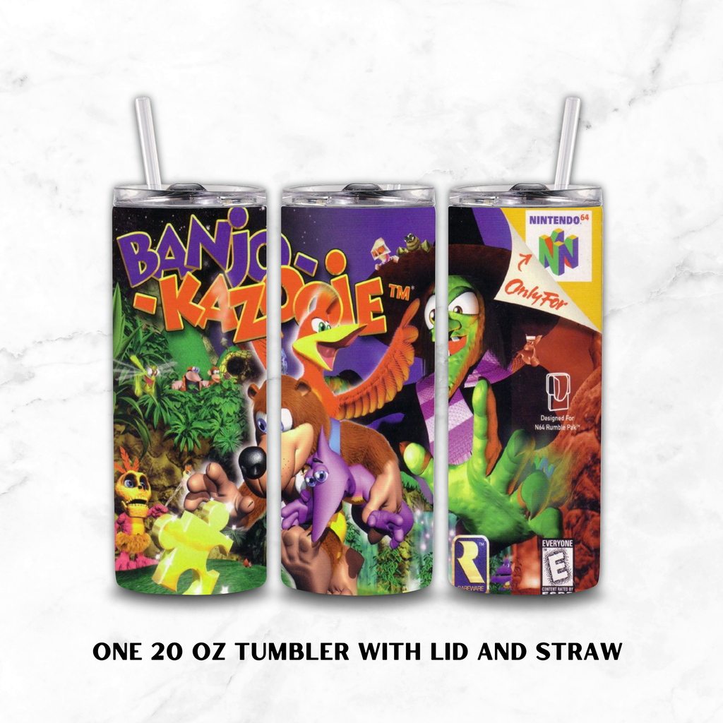 Three views of a 20 oz insulated tumbler with lid and straw, featuring colorful Banjo-Kazooie video game artwork on a white marble background. Text below reads 'ONE 20 OZ TUMBLER WITH LID AND STRAW'.