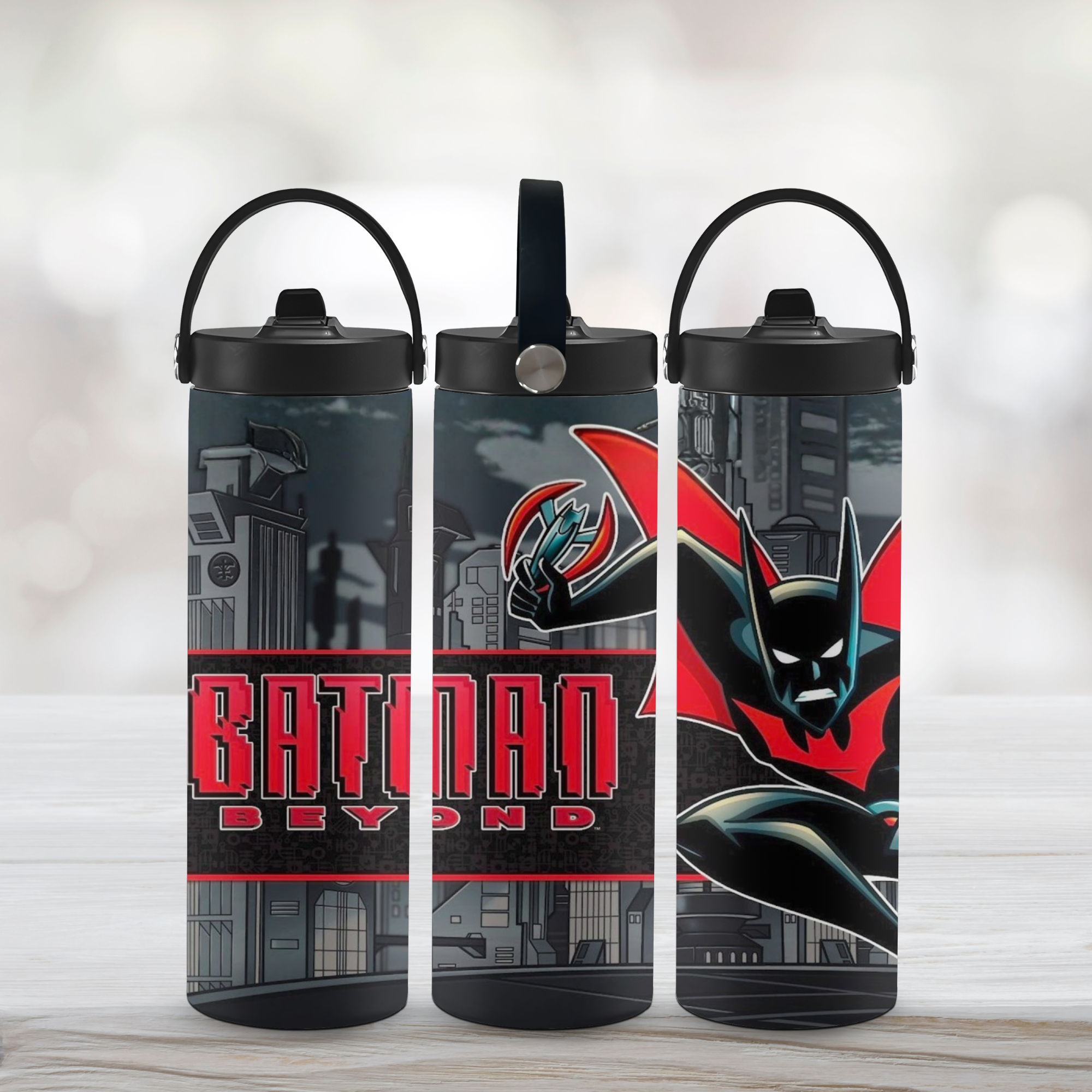 Three Batman Beyond water bottles with different designs on a light background